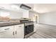 View of the kitchen featuring stainless steel appliances and granite countertops with an open concept at 4657 Curdsen Way, Las Vegas, NV 89110