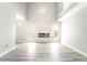 Bright, modern living room with high ceilings and fireplace feature wall at 4657 Curdsen Way, Las Vegas, NV 89110