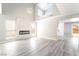 Bright, modern living room with high ceilings and fireplace feature wall at 4657 Curdsen Way, Las Vegas, NV 89110