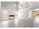 Bright, modern living room with high ceilings and fireplace feature wall at 4657 Curdsen Way, Las Vegas, NV 89110