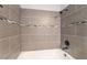 Tiled shower with brushed metal hardware at 4657 Curdsen Way, Las Vegas, NV 89110