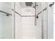 Tiled shower with rainfall shower head and glass door at 4657 Curdsen Way, Las Vegas, NV 89110