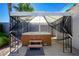 Outdoor hot tub gazebo with privacy screens and landscaping at 4774 Walteta Way, Las Vegas, NV 89119