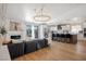 Open-concept living area with stylish furniture, a fireplace, and a view into the kitchen and backyard at 4774 Walteta Way, Las Vegas, NV 89119