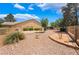 Expansive backyard featuring low-maintenance rock landscaping and privacy fencing at 4909 Desert Poppy Dr, Las Vegas, NV 89130