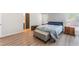 Inviting bedroom with hardwood floors, comfortable furnishings, and plenty of natural light at 4909 Desert Poppy Dr, Las Vegas, NV 89130