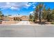 Charming single-story home with a well-maintained front yard and attached two-car garage at 4909 Desert Poppy Dr, Las Vegas, NV 89130