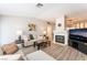 Light-filled living room features a fireplace, comfortable seating, and an entertainment center at 4909 Desert Poppy Dr, Las Vegas, NV 89130