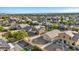 Aerial view showcasing the neighborhood's layout, green spaces, and residential properties at 4916 White Jade St, North Las Vegas, NV 89081