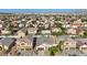 Aerial view of homes showcasing the neighborhood's layout and rooftop solar panels at 4916 White Jade St, North Las Vegas, NV 89081