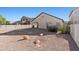 Large backyard featuring desert landscaping, rock accents, and perimeter fencing at 4916 White Jade St, North Las Vegas, NV 89081