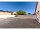 Spacious desert-landscaped backyard with potential for customization and relaxation at 4916 White Jade St, North Las Vegas, NV 89081