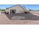 Spacious backyard with desert landscaping, including a covered patio at 4916 White Jade St, North Las Vegas, NV 89081