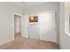 Bedroom with a neutral color scheme, closet, mounted TV and carpeted floor at 4916 White Jade St, North Las Vegas, NV 89081