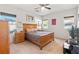 Spacious bedroom featuring a ceiling fan, plush carpet and a wooden bed frame at 4916 White Jade St, North Las Vegas, NV 89081