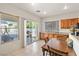 Bright dining area with a sliding glass door leading to the backyard at 4916 White Jade St, North Las Vegas, NV 89081