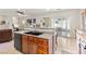Kitchen features a breakfast bar overlooking the living area and sliding glass doors to the backyard at 4916 White Jade St, North Las Vegas, NV 89081