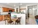 Well-designed kitchen with wood cabinets, stainless appliances, and a cozy dining space at 4916 White Jade St, North Las Vegas, NV 89081