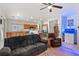 Spacious living room with a kitchen and dining area in the background, and comfortable seating at 4916 White Jade St, North Las Vegas, NV 89081