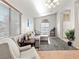 Sunlit living room boasts neutral paint, large windows, and a comfortable seating arrangement at 4916 White Jade St, North Las Vegas, NV 89081