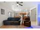 Comfortable living room with a large window providing natural light and a kitchen in background at 4916 White Jade St, North Las Vegas, NV 89081