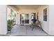 Covered patio area with concrete flooring and a charming porch swing at 4916 White Jade St, North Las Vegas, NV 89081