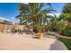Lush backyard with mature landscaping, a built-in pool, and a rock waterfall feature at 5021 Ropers Rock Ct, Las Vegas, NV 89131