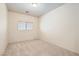 Neutral bedroom featuring plush carpet, natural lighting, and ample space at 5021 Ropers Rock Ct, Las Vegas, NV 89131