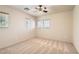 Bright bedroom featuring a ceiling fan and multiple windows for natural light and ventilation at 5021 Ropers Rock Ct, Las Vegas, NV 89131