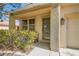 Welcoming front entrance with an ornate security door, covered porch, and a well-maintained front yard at 5021 Ropers Rock Ct, Las Vegas, NV 89131