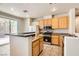Well-lit kitchen featuring granite countertops, stainless steel appliances, and ample cabinet space at 5021 Ropers Rock Ct, Las Vegas, NV 89131