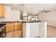 Open kitchen with stainless appliances, tile floors, granite counters, and eat-in bar at 5021 Ropers Rock Ct, Las Vegas, NV 89131