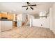 Open floor plan with eat-in kitchen, backyard access, and wood stairs at 5021 Ropers Rock Ct, Las Vegas, NV 89131