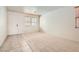 Bright and airy living room featuring a tiled entrance, carpet, neutral paint, and natural light at 5021 Ropers Rock Ct, Las Vegas, NV 89131