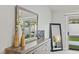 Bedroom featuring a dresser with a mirror, a bed, and backyard access at 5108 Molveno Ct, Las Vegas, NV 89130