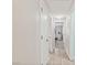 Bright hallway with tile floors and access to bedrooms, providing seamless movement throughout the home at 5108 Molveno Ct, Las Vegas, NV 89130