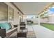 Covered patio complete with seating, a barbecue, and string lights at 5108 Molveno Ct, Las Vegas, NV 89130
