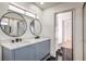 Bathroom with dual sinks, large mirrors, and modern design at 5825 Bent Branch Ln, Las Vegas, NV 89142