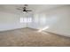 Large bedroom with plantation shutters and modern ceiling fan at 5825 Bent Branch Ln, Las Vegas, NV 89142