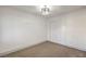 Bedroom features plush carpet and a modern lighting fixture at 5825 Bent Branch Ln, Las Vegas, NV 89142