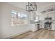 Bright kitchen featuring stainless steel appliances, white cabinets, and modern lighting fixtures at 5825 Bent Branch Ln, Las Vegas, NV 89142
