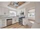 Modern kitchen with white cabinets, stainless steel appliances, and stylish backsplash at 5825 Bent Branch Ln, Las Vegas, NV 89142