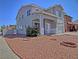Charming two-story home featuring a xeriscaped front yard with desert landscaping and lovely curb appeal at 6042 Thorne Bay Ct, Las Vegas, NV 89110