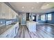 Open-concept kitchen featuring granite countertops, stainless steel appliances, and an eat-in island at 6042 Thorne Bay Ct, Las Vegas, NV 89110