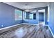 The living room features modern wood-look flooring and a pass through to another room at 6042 Thorne Bay Ct, Las Vegas, NV 89110