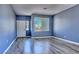 Inviting living room features large window and a door at 6042 Thorne Bay Ct, Las Vegas, NV 89110