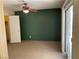 Spacious bedroom features neutral paint, carpeted floors, and a sliding door to patio at 6241 Pinewood Ave, Las Vegas, NV 89103