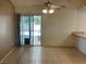 Bright dining area featuring tiled floors, neutral paint, and a sliding door to patio at 6241 Pinewood Ave, Las Vegas, NV 89103