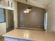 Open dining area features neutral paint, a modern ceiling fan, and sliding door to patio at 6241 Pinewood Ave, Las Vegas, NV 89103