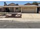 Charming single-story home with a well-maintained front yard and two-car garage at 6241 Pinewood Ave, Las Vegas, NV 89103